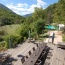 The barbecue deck leads past the boules pitch to the pool