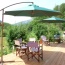 The barbecue terrace, in between the dining room balcony and the swimming pool, offers plenty of shade for an alfresco lunch